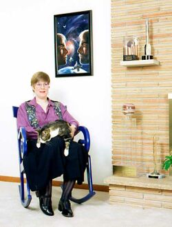 (Colour photo of Lois McMaster Bujold and cat)